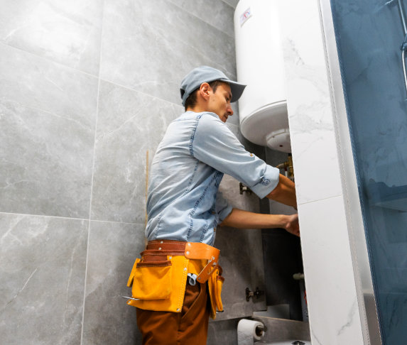 man fixing the boiler