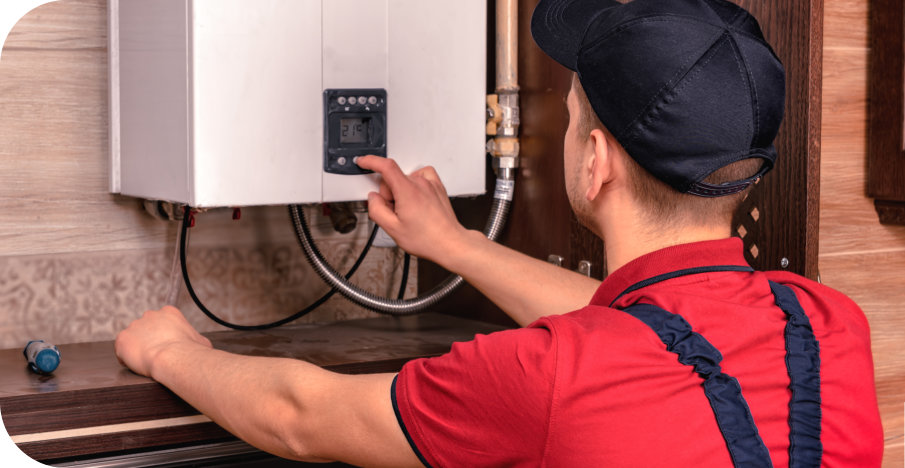 man adjusting the boiler temperature