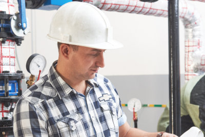 men working in the boiler room