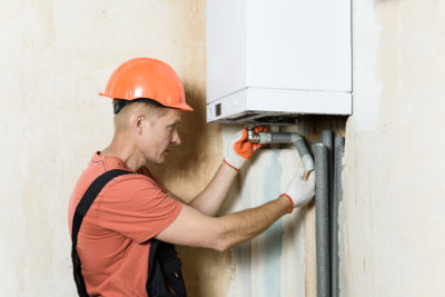 man fixing the boiler