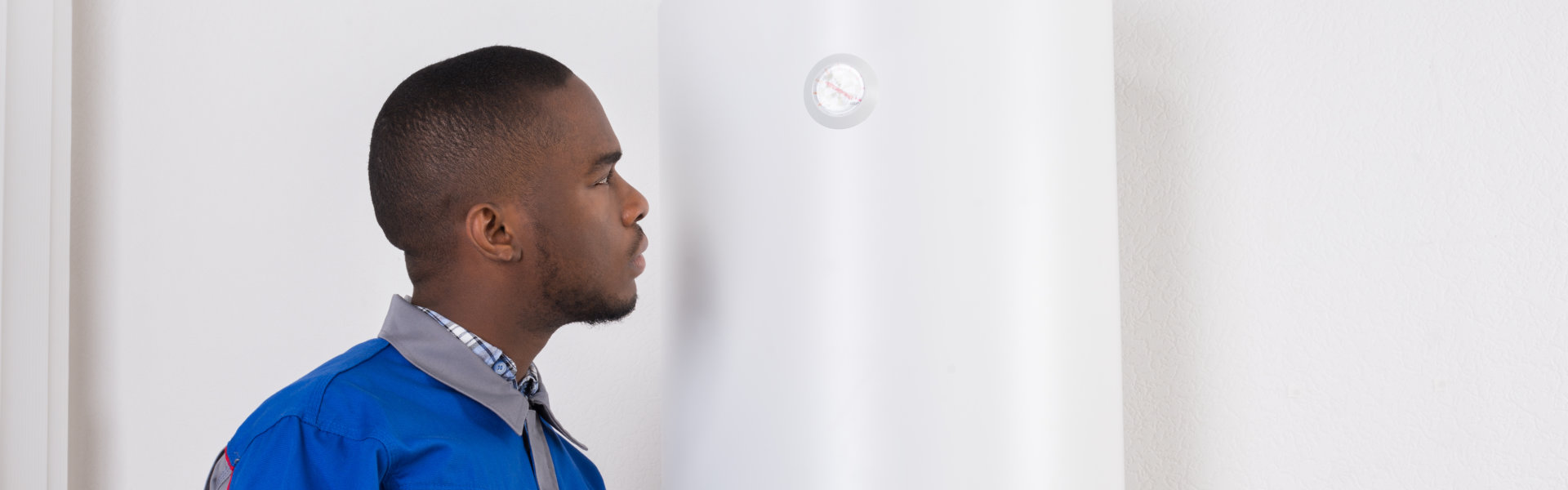 man checking the boiler