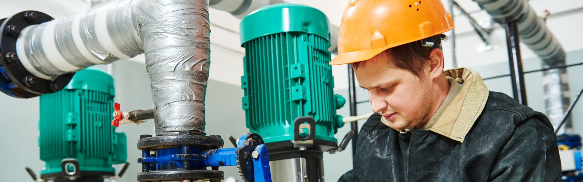 man checking somthing in the boiler room