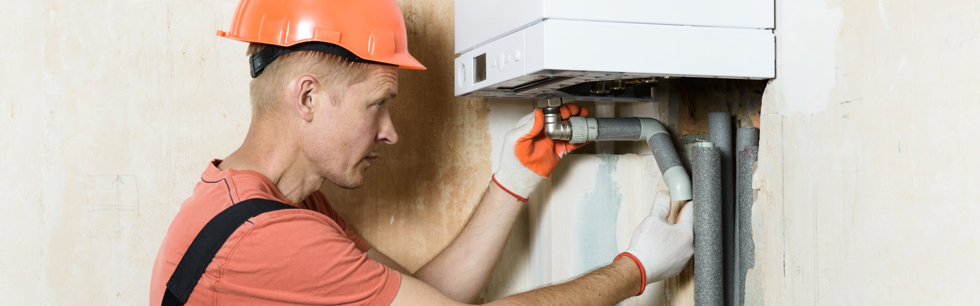 man fixing the boiler